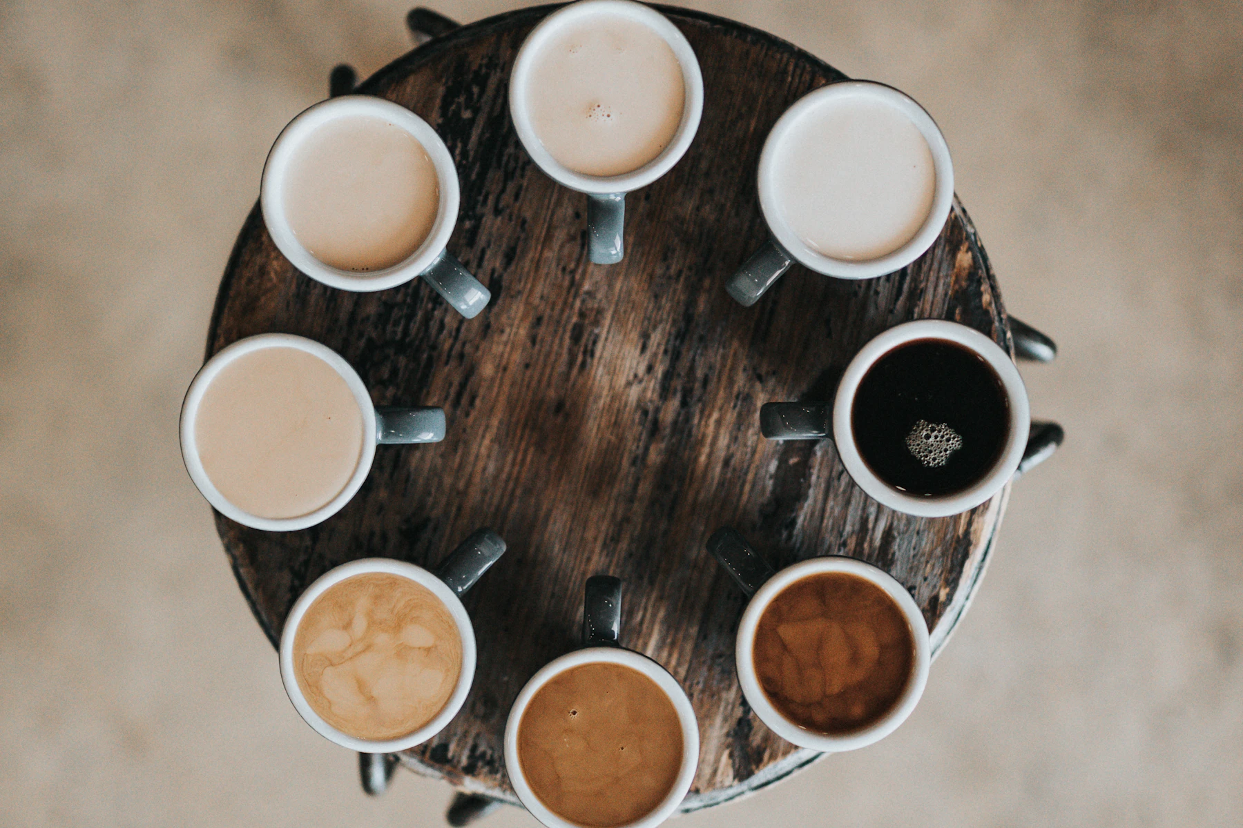 Coffee beans and a finished espresso drink